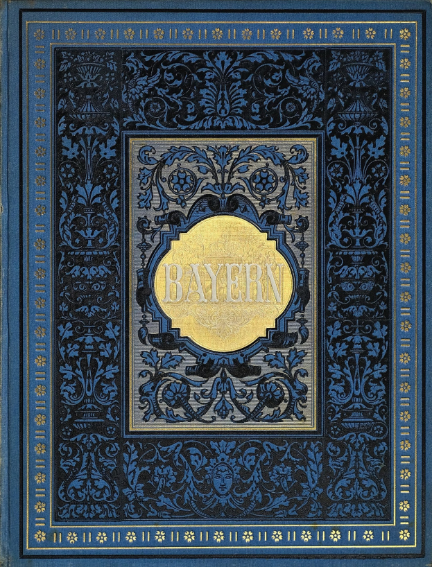 Ein blau-goldenes Buch mit dem Wort "Bayern" auf dem Cover, das mit detaillierten Verzierungen geschmückt ist.