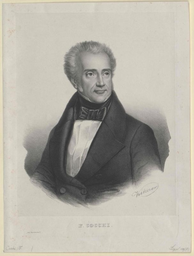 Schwarzes und weißes Porträt von F. Cocchi, dem Komponist der Oper, in einem Smoking mit ernster Miene, betitelt mit "Die Musik der Oper" unten.