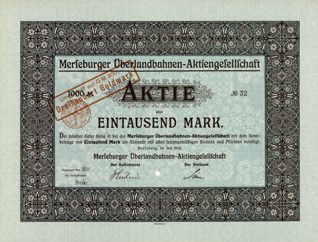 Altes deutsches Aktienzertifikat mit schwarzem Rand, roter Stempel und gedrucktem Text über die Aktienherkunft.