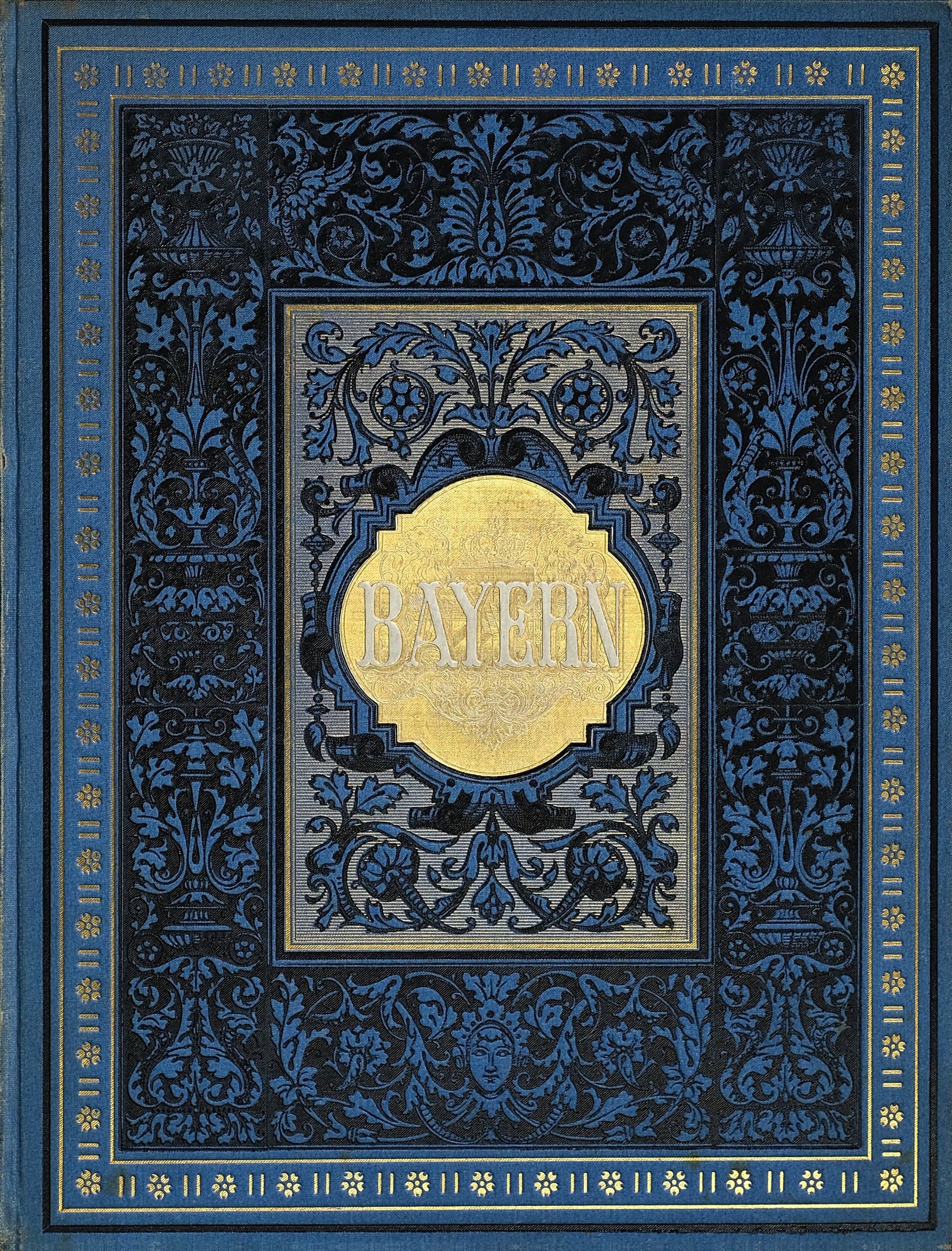 Blau-goldenes Buch mit dem Wort 'Bayern' auf dem Cover, verziert mit aufwändigen Designs.