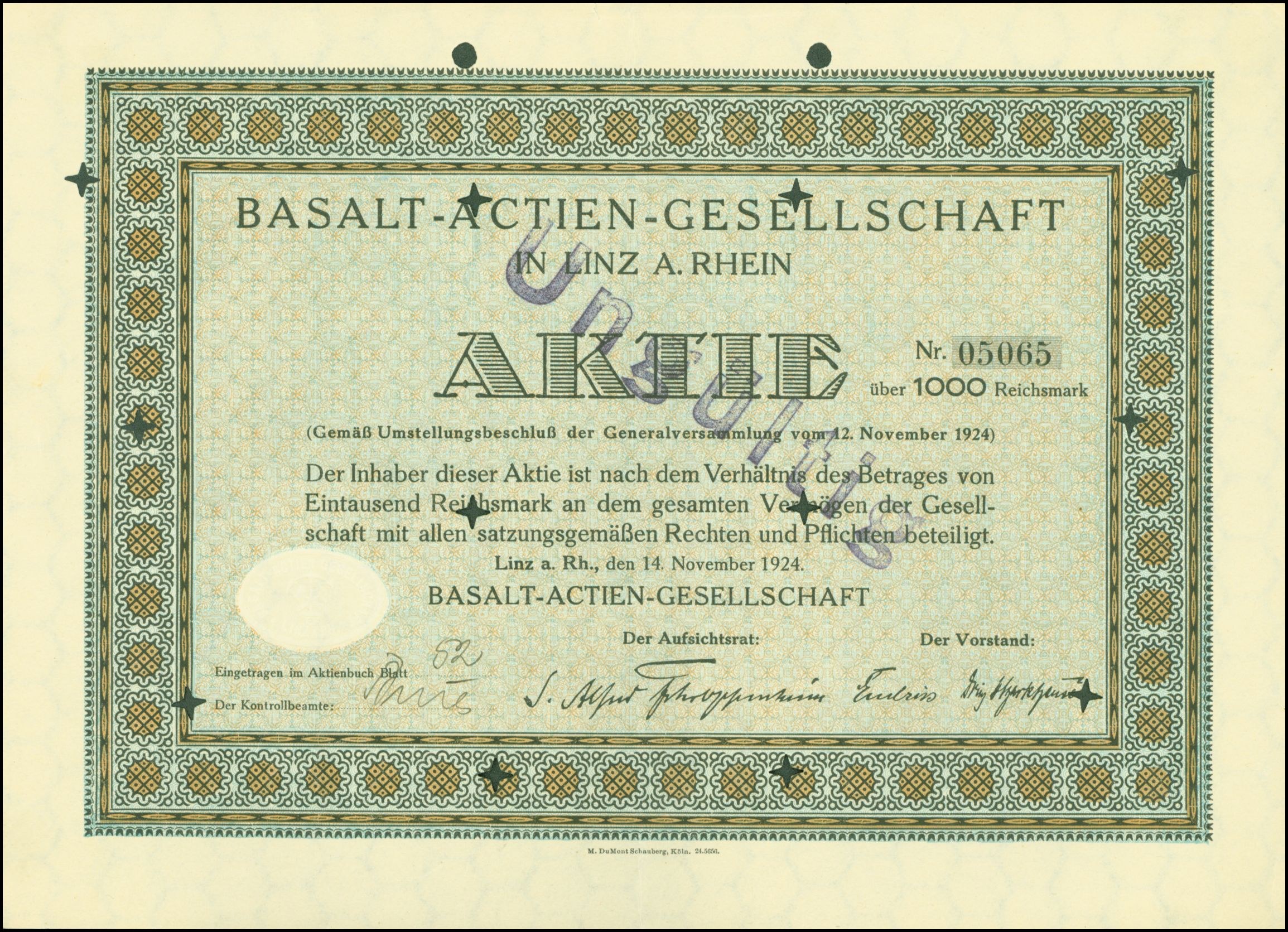 Rahmung alter Aktienurkunde ausgestellt von Basalt-Actien-Gesellschaft in Linz, Deutschland mit sichtbarem Text.