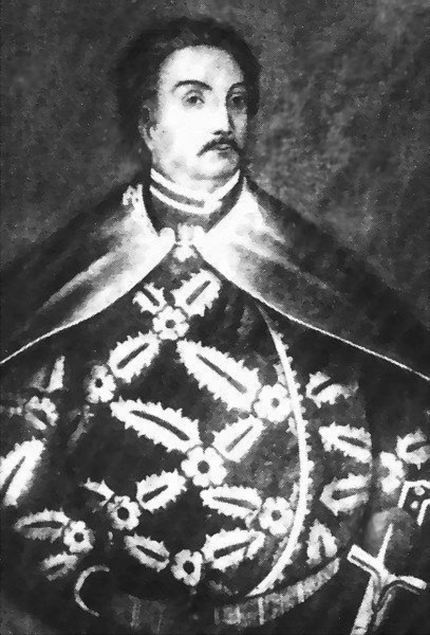 Schwarzes und weißes Foto von Papst Johannes Paul II. in Priesterkleidung, der eine schwarze Robe mit weißem Kragen und Manschetten trägt, die Hände gefaltet, strenger Gesichtsausdruck.
